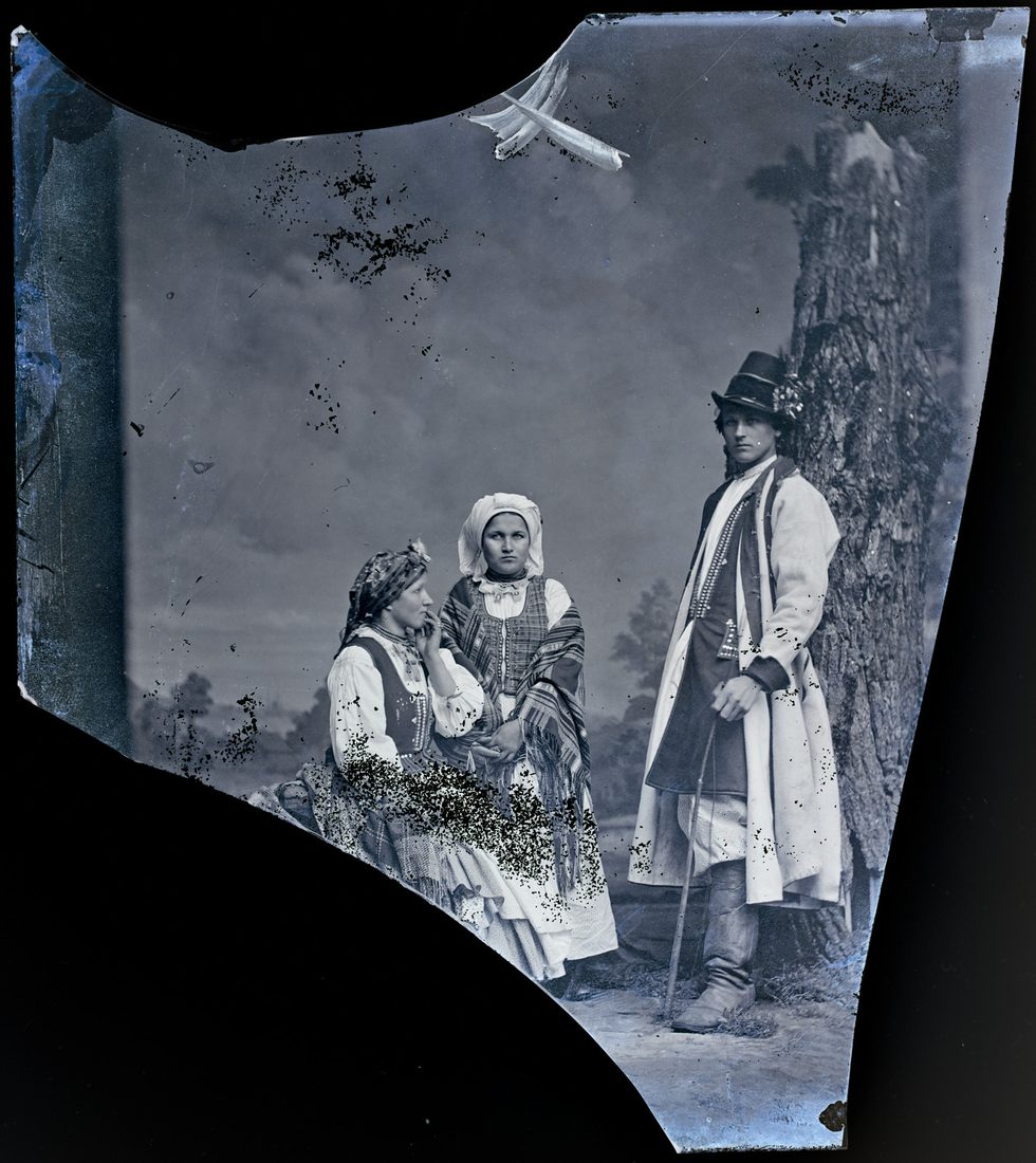 Man and two women in folk costume, portrait, 1867–1880