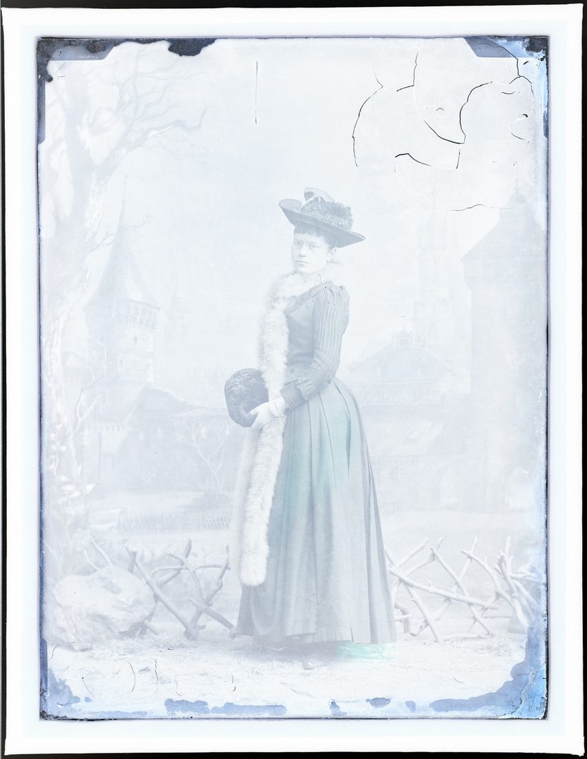 Young woman in a fur stole with a muff, portrait